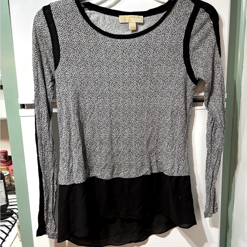Michael Kors black & white long sleeve blouse with sheer bottom.